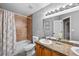 Well-maintained bathroom with granite countertop, framed mirror, bathtub, and shower at 603 E 2Nd Ave, Castle Rock, CO 80108