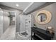 Cozy bathroom with a shower, neutral walls, and decorative mirror at 603 E 2Nd Ave, Castle Rock, CO 80108