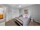 Bright bedroom with double door closet, ceiling fan and doorway leading to bathroom at 603 E 2Nd Ave, Castle Rock, CO 80108