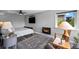 Comfortable bedroom with a modern fireplace, ceiling fan, and view to the yard at 603 E 2Nd Ave, Castle Rock, CO 80108
