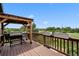Wooden deck featuring a grill, pergola, planter boxes, and a scenic view of the surrounding landscape at 603 E 2Nd Ave, Castle Rock, CO 80108