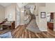 Bright foyer with high ceilings, wood floors, and an elegant staircase at 603 E 2Nd Ave, Castle Rock, CO 80108
