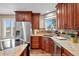 Well-equipped kitchen featuring stainless steel appliances, granite countertops, and wood cabinets at 603 E 2Nd Ave, Castle Rock, CO 80108