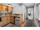 Home kitchenette featuring granite countertops, wooden cabinets, and a mini-refrigerator at 603 E 2Nd Ave, Castle Rock, CO 80108