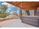 View of backyard patio with hot tub and wood ceiling at 11938 S Meander Way, Parker, CO 80138