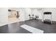 Basement gym with weights and treadmill; open to entertainment area with pool table at 11938 S Meander Way, Parker, CO 80138