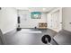 Basement gym with TV, weights and punching bag with rubber flooring at 11938 S Meander Way, Parker, CO 80138