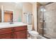 Bathroom with vanity, toilet, and glass-enclosed tile shower at 11938 S Meander Way, Parker, CO 80138