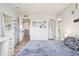 Bright bedroom showcasing a comfortable bed and access to both a bathroom and the main hallway at 11938 S Meander Way, Parker, CO 80138