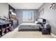 Bedroom has a queen-sized bed, dresser, TV, and car-themed wallpaper at 11938 S Meander Way, Parker, CO 80138
