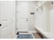 Mudroom with bench, cubbies, and coat hooks to provide space to organize coats and shoes at 11938 S Meander Way, Parker, CO 80138
