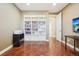 Organized home office features custom built-in shelving and storage, with wood flooring at 11938 S Meander Way, Parker, CO 80138