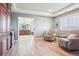 Inviting sitting area with dual armchairs, built-in cabinetry and a glimpse into the serene bathroom at 11938 S Meander Way, Parker, CO 80138