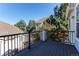 View from wood deck with black railing showcases the neighborhood, trees, and blue sky at 2847 Mount Royal Dr, Castle Rock, CO 80104