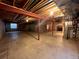 Unfinished basement offers a blank canvas with exposed ducts and support beams at 3930 S Quatar St, Aurora, CO 80018