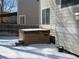 Outdoor hot tub nestled in a snow-covered backyard setting at 3930 S Quatar St, Aurora, CO 80018