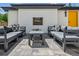 Stylish outdoor living space with a fireplace, comfortable seating, and modern design at 1195 S Milwaukee St, Denver, CO 80210
