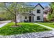 A bright home with a manicured lawn, a walkway to the front door, and a mature shade tree at 1195 S Milwaukee St, Denver, CO 80210
