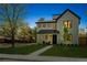 A bright modern two-story home with dark window trim, a manicured lawn, and a walkway at 1195 S Milwaukee St, Denver, CO 80210