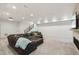 Finished basement featuring a large sectional sofa and a fireplace at 3343 S Newcombe St, Lakewood, CO 80227