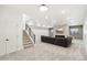 Finished basement with a sectional sofa and a stone fireplace at 3343 S Newcombe St, Lakewood, CO 80227