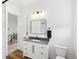 Bathroom with a vanity, toilet, and a view to the upper floor at 3343 S Newcombe St, Lakewood, CO 80227