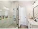 Clean bathroom with a walk-in shower and white vanity at 3343 S Newcombe St, Lakewood, CO 80227