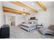 Elegant bedroom featuring a comfortable seating area and large windows at 3343 S Newcombe St, Lakewood, CO 80227