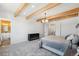 Bright bedroom with ensuite bathroom and wood beams at 3343 S Newcombe St, Lakewood, CO 80227