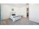 Cozy bedroom featuring a white bed frame and gray carpet at 3343 S Newcombe St, Lakewood, CO 80227