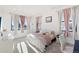 Charming bedroom with pink accents and plenty of natural light at 3343 S Newcombe St, Lakewood, CO 80227