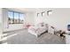 Light and airy bedroom with a window seat and lots of natural light at 3343 S Newcombe St, Lakewood, CO 80227