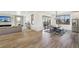Open dining area with hardwood floors, table and chairs, and access to backyard at 3343 S Newcombe St, Lakewood, CO 80227