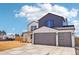 Two-story home with a three-car garage at 3343 S Newcombe St, Lakewood, CO 80227