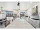 Modern kitchen with white cabinets, quartz countertops, and a large island at 3343 S Newcombe St, Lakewood, CO 80227