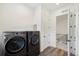 Laundry room with washer, dryer, and access to upper floor at 3343 S Newcombe St, Lakewood, CO 80227