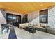 Covered patio with seating and fire pit at 3343 S Newcombe St, Lakewood, CO 80227