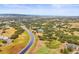 Panoramic aerial view of a home and surrounding neighborhood with rolling hills and distant mountains at 1635 Sharps Ct, Castle Rock, CO 80109