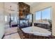 Luxurious bathroom with a soaking tub, fireplace, and elegant marble accents at 1635 Sharps Ct, Castle Rock, CO 80109