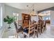 Formal dining room showcasing an elegant chandelier and a large window at 1635 Sharps Ct, Castle Rock, CO 80109