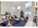 Bright and airy living room showcasing a fireplace and large windows with views at 1635 Sharps Ct, Castle Rock, CO 80109