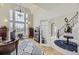 Light-filled office with large arched window and hardwood floors at 1635 Sharps Ct, Castle Rock, CO 80109
