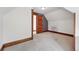 Finished attic space features plush carpeting and classic wood trim accents at 3330 W 30Th Ave, Denver, CO 80211