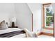 Bedroom with natural light and wood trim at 3330 W 30Th Ave, Denver, CO 80211