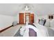 Spacious bedroom features wood trim, built-in storage, and a ceiling fan at 3330 W 30Th Ave, Denver, CO 80211