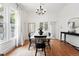 Bright dining room with hardwood floors, classic chandelier, and natural light at 3330 W 30Th Ave, Denver, CO 80211