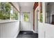 Bright entryway with black tile flooring, beadboard paneling, and natural light at 3330 W 30Th Ave, Denver, CO 80211