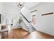 Bright foyer with hardwood floors, staircase, and ample natural light at 3330 W 30Th Ave, Denver, CO 80211