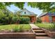 Inviting home exterior featuring a brick walkway leading to the front door at 3330 W 30Th Ave, Denver, CO 80211