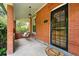 Relaxing front porch with swing, brick columns, and charming details at 3330 W 30Th Ave, Denver, CO 80211